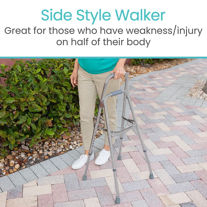 Person walking outdoors using a side-style hemi walker in one hand