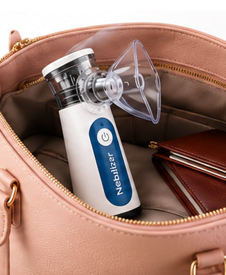 Portable Nebulizer tucked inside a handbag beside a wallet